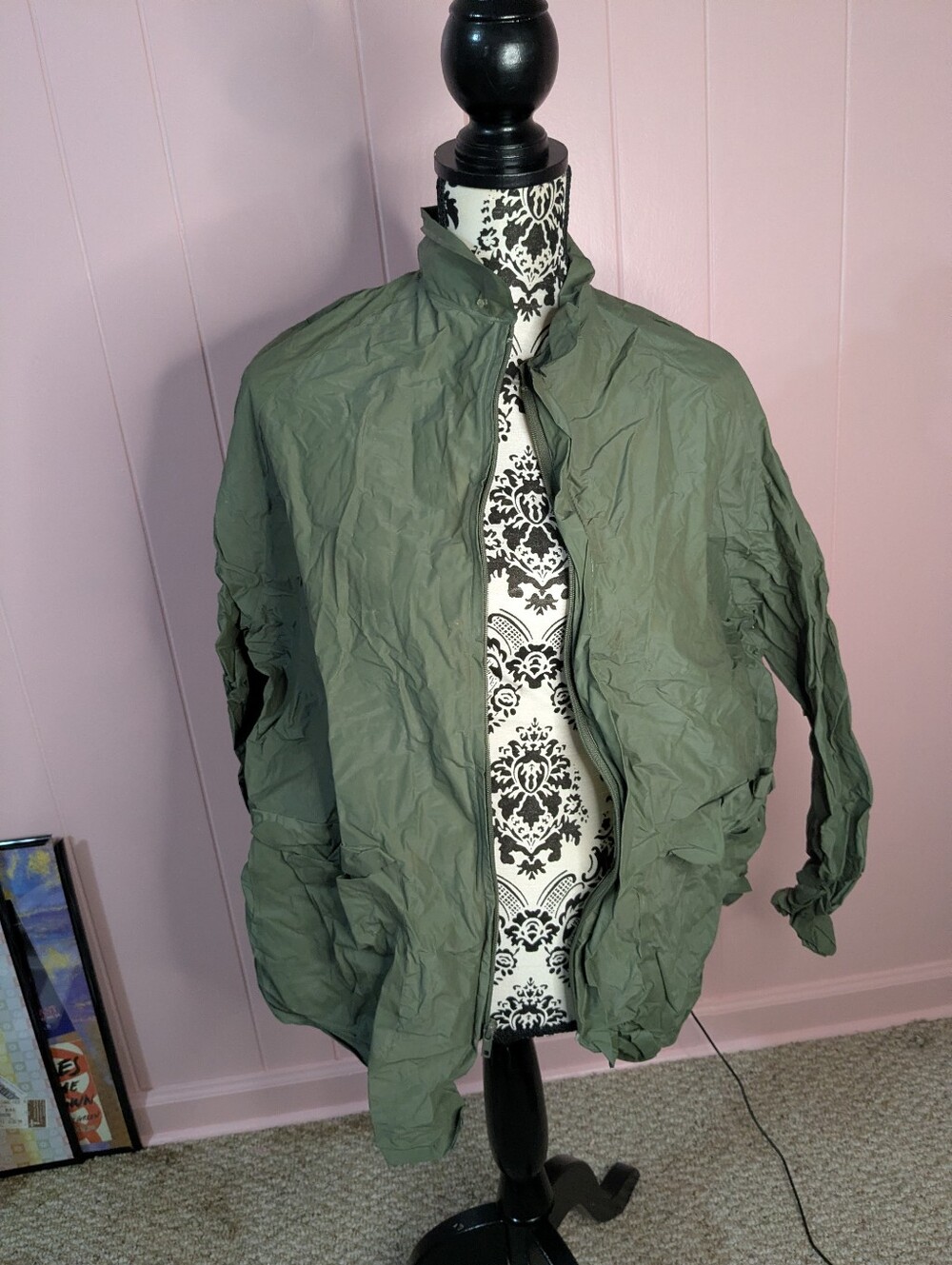 green raincoat - size M